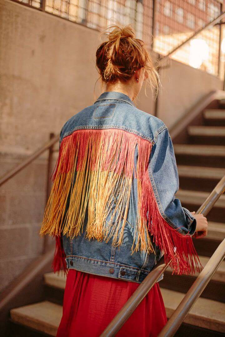 Pretty DIY Fringe Jean Jacket, add up the jean jackets with the colorful fringes and create a bohemian special appeal of it